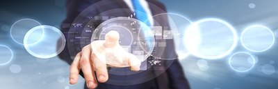 A businessman touching a glowing global network interface of connected circles and icons.